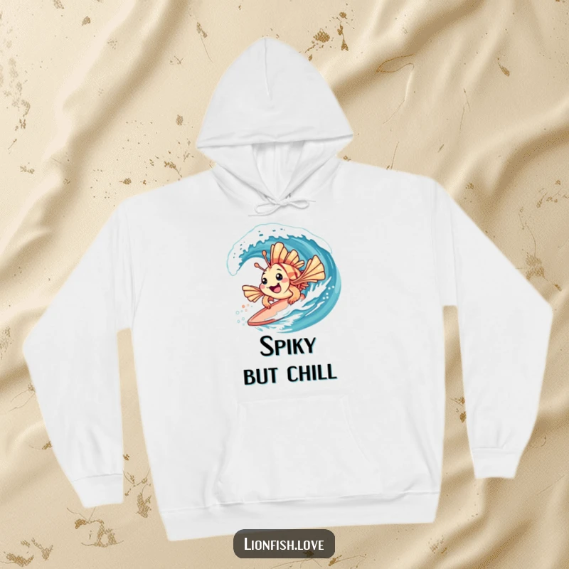 Funny hoodie showcasing a playful lionfish with spiky fins surfing on a gentle wave, perfect for cozy beach days.